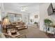 Living room with sofa and access to deck at 6001 - 5238 S Kings Hwy., Myrtle Beach, SC 29575