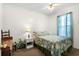 Cozy bedroom with a double bed, nightstand, and window with curtains at 6001 - 5238 S Kings Hwy., Myrtle Beach, SC 29575