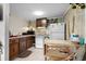 Galley kitchen with wood cabinets, white appliances, and ample counter space at 6001 - 5238 S Kings Hwy., Myrtle Beach, SC 29575
