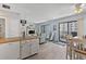 Kitchen with white cabinets and access to the living room at 5905 S Kings Highway # 416-B, Myrtle Beach, SC 29575