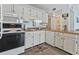 Bright kitchen with white cabinets and a dishwasher at 5905 S Kings Highway # 416-B, Myrtle Beach, SC 29575