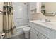 Bathroom with tub, toilet and vanity with white cabinets at 5905 S Kings Highway # 416-B, Myrtle Beach, SC 29575
