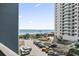 Partial ocean view from balcony, with parking and building views at 5905 S Kings Highway # 416-B, Myrtle Beach, SC 29575