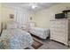 Bedroom with twin beds, dresser, and coastal decor at 5905 S Kings Highway # 416-B, Myrtle Beach, SC 29575