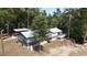 Aerial view of house, detached shed and riverfront lot at 7122 Cox Lake Dr., Mullins, SC 29574