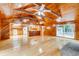 Open kitchen with island, wood cabinets, and hardwood floors at 7122 Cox Lake Dr., Mullins, SC 29574