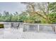 Deck overlooking the river with small table and chairs at 7122 Cox Lake Dr., Mullins, SC 29574