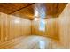 Simple bedroom with wood paneled walls and hardwood floors at 7122 Cox Lake Dr., Mullins, SC 29574