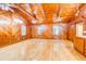 Living area with wood walls, vaulted ceiling, and hardwood floors at 7122 Cox Lake Dr., Mullins, SC 29574