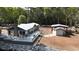 Aerial view of house, deck, detached shed and riverfront lot at 7122 Cox Lake Dr., Mullins, SC 29574