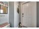Condo entryway with bench and decor at 415 N Ocean Blvd. # 302, Surfside Beach, SC 29575