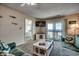 Oceanfront living room with comfortable seating and access to balcony at 415 N Ocean Blvd. # 302, Surfside Beach, SC 29575