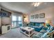 Spacious living room with ocean view, comfy sofas and large TV at 415 N Ocean Blvd. # 302, Surfside Beach, SC 29575