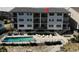 Condo building with pool and patio area at 415 N Ocean Blvd. # 302, Surfside Beach, SC 29575