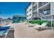 Community pool with lounge chairs for relaxing at 415 N Ocean Blvd. # 302, Surfside Beach, SC 29575