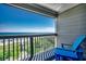 Private balcony overlooking the ocean with seating for relaxation at 415 N Ocean Blvd. # 302, Surfside Beach, SC 29575