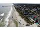Aerial view showcasing oceanfront property and community pool at 415 N Ocean Blvd. # 302, Surfside Beach, SC 29575
