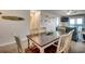 Simple dining area with table and chairs near living room at 415 N Ocean Blvd. # 302, Surfside Beach, SC 29575