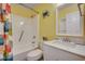 Second bathroom with tub shower, vanity, and updated fixtures at 415 N Ocean Blvd. # 302, Surfside Beach, SC 29575