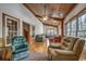 Relaxing sunroom with hardwood floors and ample natural light at 7018 Cox Lake Ct., Mullins, SC 29574