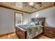 Charming bedroom with wood floors and a rustic ceiling at 7018 Cox Lake Ct., Mullins, SC 29574