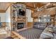 Living room features a stone fireplace and hardwood floors at 7018 Cox Lake Ct., Mullins, SC 29574