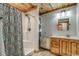 Clean bathroom with shower, vanity, and linen shelves at 7018 Cox Lake Ct., Mullins, SC 29574