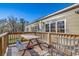 Wooden deck with a picnic table and bench at 7018 Cox Lake Ct., Mullins, SC 29574