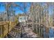 Luxury waterfront home with private dock and lush landscaping at 7018 Cox Lake Ct., Mullins, SC 29574