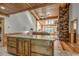 Kitchen with granite island and wooden cabinets at 7018 Cox Lake Ct., Mullins, SC 29574
