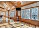 Sunlit living area showcasing hardwood floors and scenic views at 7018 Cox Lake Ct., Mullins, SC 29574