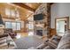 Living room with stone fireplace and high ceilings at 7018 Cox Lake Ct., Mullins, SC 29574