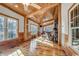 Bright living room with hardwood floors and large windows at 7018 Cox Lake Ct., Mullins, SC 29574