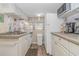 Well-equipped kitchen boasting white cabinets and modern appliances at 6001-1359 S Kings Hwy., Myrtle Beach, SC 29575