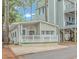 Small cottage with a deck and white railing at 6001-1359 S Kings Hwy., Myrtle Beach, SC 29575
