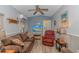Cozy living room featuring a brown sofa, recliner, and a TV at 6001-1359 S Kings Hwy., Myrtle Beach, SC 29575