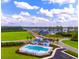 Aerial view of community pool and surrounding houses at 3022 Deerberry Place, Longs, SC 29568
