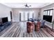 Bright living room with hardwood floors and french doors at 949 Jackline Place # 103, Murrells Inlet, SC 29576