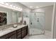 Elegant bathroom featuring a large shower, double vanity, and granite countertop at 949 Jackline Place # 103, Murrells Inlet, SC 29576