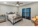Spacious bedroom with a queen bed and ceiling fan at 949 Jackline Place # 103, Murrells Inlet, SC 29576