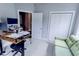 Spacious home office with a desk, sofa, and built-in closet at 949 Jackline Place # 103, Murrells Inlet, SC 29576
