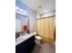 Clean bathroom with granite vanity and shower/tub combo at 949 Jackline Place # 103, Murrells Inlet, SC 29576