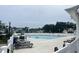 Community pool with lounge chairs and patio furniture at 949 Jackline Place # 103, Murrells Inlet, SC 29576