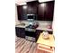 Well-equipped kitchen with dark cabinetry and stainless steel range at 949 Jackline Place # 103, Murrells Inlet, SC 29576