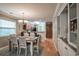 Bright dining room with a wooden table, chairs and a view of the kitchen at 366 Pinehurst Ln. # 13D, Pawleys Island, SC 29585
