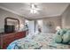 Main bedroom with king-size bed, dresser and views into the living room and bathroom at 366 Pinehurst Ln. # 13D, Pawleys Island, SC 29585