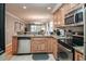 Modern kitchen boasting stainless steel appliances and granite countertops at 366 Pinehurst Ln. # 13D, Pawleys Island, SC 29585