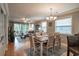 Elegant dining room featuring a wood table and chairs, with views into the living room at 366 Pinehurst Ln. # 13D, Pawleys Island, SC 29585