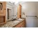 Bathroom with granite countertop, light wood cabinets, and a large mirror at 366 Pinehurst Ln. # 13D, Pawleys Island, SC 29585