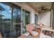 Relaxing screened porch with wicker furniture and tranquil wooded views at 366 Pinehurst Ln. # 13D, Pawleys Island, SC 29585